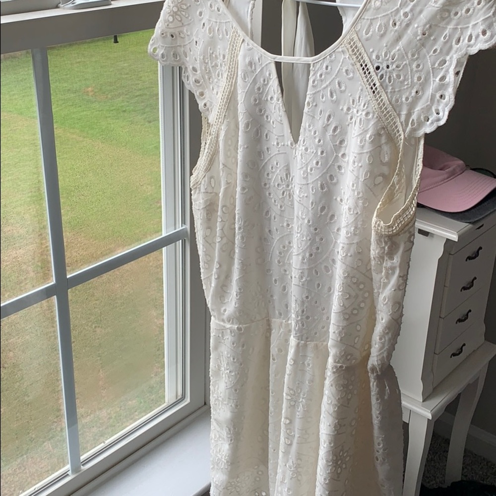 Cream eyelet romper with tie back detail